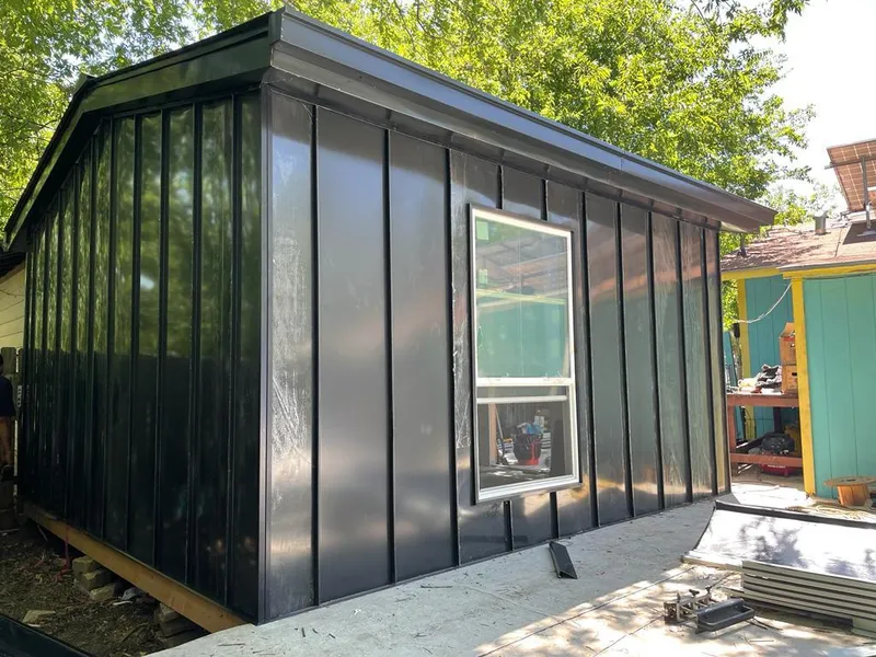 Black standing seam metal wall panels for Roof Inspection in Irondequoit