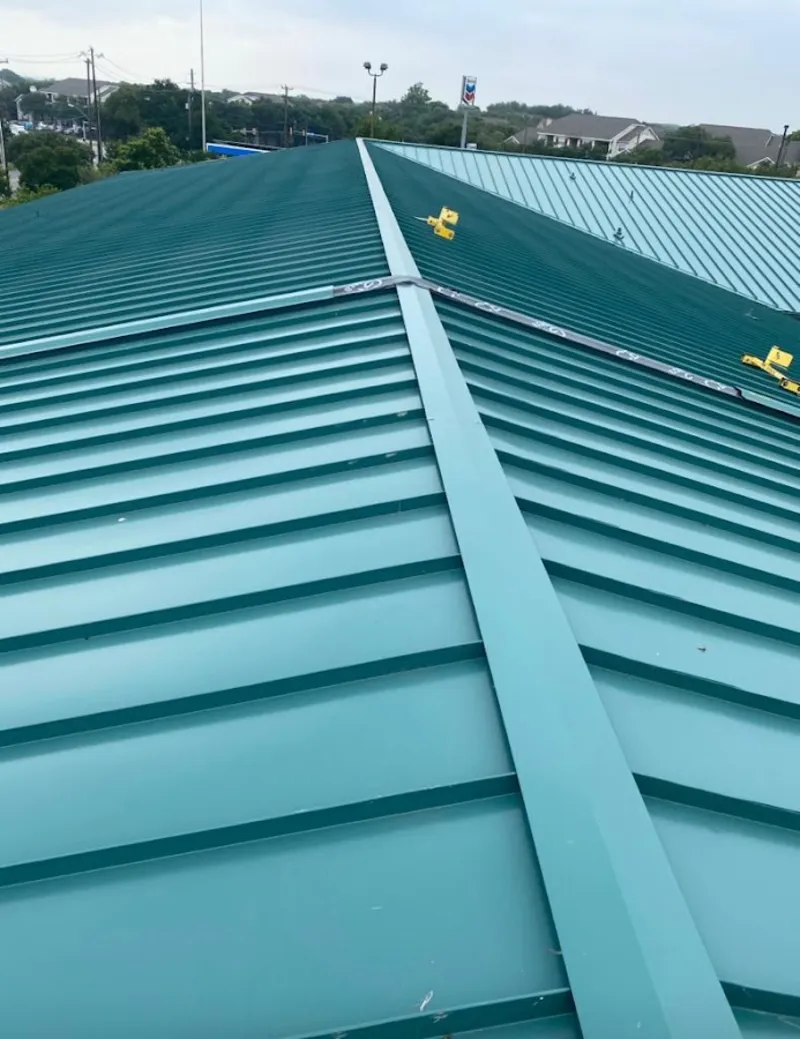 Green commercial metal roof ridge and valley for Metal Roof Repair in Irondequoit
